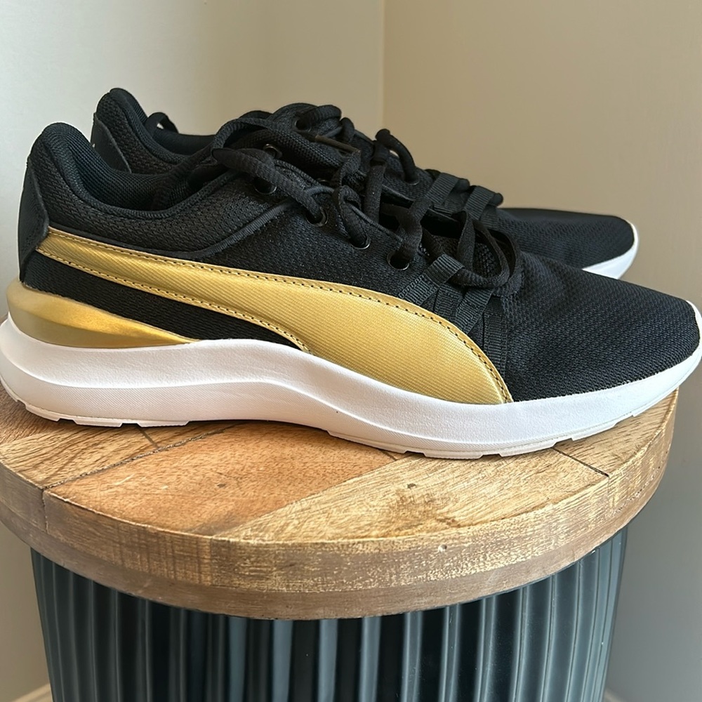 Puma black and gold running shoes